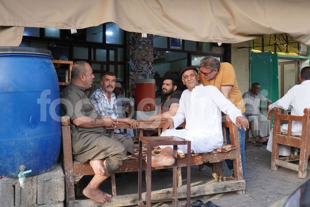 A group of people sitting in a traditional café