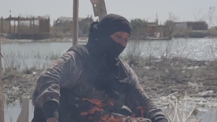 Iraqi marshes, a woman grilling, Al-Chibayish marshes